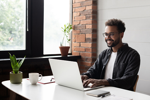Image of man working from home at desk